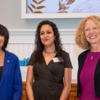 Faculty smiling after receiving gift